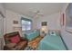 This bedroom has two twin beds, wood flooring, ceiling fan, and dresser at 13024 Prestwick Dr, Riverview, FL 33579