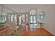 Elegant dining room with a glass table set and chandelier, offering a sophisticated space for gatherings at 13024 Prestwick Dr, Riverview, FL 33579