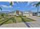 Charming single-Gathering home features lush landscaping, a well-manicured lawn, and an attached two-car garage at 13024 Prestwick Dr, Riverview, FL 33579
