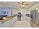 Modern kitchen featuring stainless steel appliances, granite countertops and ample white cabinet space at 13024 Prestwick Dr, Riverview, FL 33579