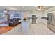 Open kitchen with stainless steel appliances, granite countertops, and a seamless transition to the living space at 13024 Prestwick Dr, Riverview, FL 33579