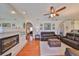 Bright living room with fireplace, hardwood floors and easy access to the kitchen and bedrooms at 13024 Prestwick Dr, Riverview, FL 33579