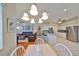 Open-concept living spaces including the kitchen, dining area, and living room with ample natural light at 13024 Prestwick Dr, Riverview, FL 33579
