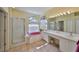 Main bathroom boasts a soaking tub, separate shower, double vanity, and ample counter space at 13024 Prestwick Dr, Riverview, FL 33579