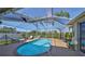 A private backyard features a screened in pool and sun loungers at 13024 Prestwick Dr, Riverview, FL 33579