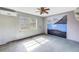 Bedroom featuring a unique mural, window, and ceiling fan at 2028 Blossom S Way, St Petersburg, FL 33712