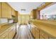 Functional kitchen featuring light-colored cabinetry and modern appliances at 2028 Blossom S Way, St Petersburg, FL 33712