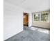 Bright, airy sun room with adjacent bedroom featuring neutral color palette at 2028 Blossom S Way, St Petersburg, FL 33712