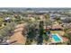 Aerial shot showcasing the community, swimming pool, and surrounding landscape at 2606 Oak Cir, Tarpon Springs, FL 34689