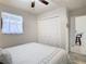 Cozy bedroom with a comfortable bed, soft lighting, and a ceiling fan creating a relaxing retreat at 2606 Oak Cir, Tarpon Springs, FL 34689