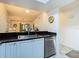 Contemporary kitchen featuring a stainless steel dishwasher, and plenty of natural light for enjoyable meal preparation at 2606 Oak Cir, Tarpon Springs, FL 34689