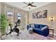 Bright and airy living room area, featuring a modern ceiling fan and ample natural light at 2677 Northwood Park St, Valrico, FL 33596