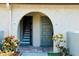 A condo entryway with a tiled floor and a view of the staircase at 6262 142Nd Ave # 506, Clearwater, FL 33760