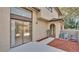 Two story condo building featuring a fenced patio with sliding glass doors at 6262 142Nd Ave # 506, Clearwater, FL 33760