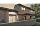 Two story condo building featuring a fenced patio with sliding glass doors at 6262 142Nd Ave # 506, Clearwater, FL 33760