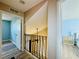 Hallway with a view of the staircase and a bedroom with blue walls at 6262 142Nd Ave # 506, Clearwater, FL 33760