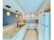 Bright kitchen with granite countertops and stainless steel appliances at 6262 142Nd Ave # 506, Clearwater, FL 33760