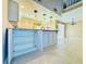 Open kitchen featuring a breakfast bar and a view to the living area at 6262 142Nd Ave # 506, Clearwater, FL 33760