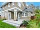 Charming back porch with neutral-colored wood and lush landscaping around it at 705 S Fielding Ave, Tampa, FL 33606