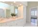 Bathroom features a double sink vanity, ample cabinet storage, and modern lighting at 705 S Fielding Ave, Tampa, FL 33606