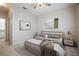 Cozy bedroom featuring a queen-size bed, soft rug, and elegant design at 1216 S Missouri Ave # 224, Clearwater, FL 33756
