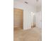 Bright bedroom with an open closet featuring wire shelving and a neutral color scheme at 1216 S Missouri Ave # 224, Clearwater, FL 33756