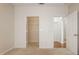 Bright bedroom with an open closet featuring wire shelving and a neutral color scheme at 1216 S Missouri Ave # 224, Clearwater, FL 33756