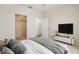 Bedroom featuring closet, television, and plenty of space at 1216 S Missouri Ave # 224, Clearwater, FL 33756