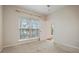 Bedroom featuring neutral colors, closet, and large window at 1216 S Missouri Ave # 224, Clearwater, FL 33756