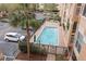 Aerial view of the community swimming pool with parking and landscaping at 1216 S Missouri Ave # 224, Clearwater, FL 33756