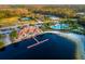 Aerial shot of the community amenities including a pool and clubhouse surrounded by lush landscaping at 10534 Bermuda Isle Dr, Tampa, FL 33647