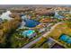 Stunning aerial view of a community featuring a pool, clubhouse, lakes, and recreational areas at 10534 Bermuda Isle Dr, Tampa, FL 33647