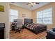 Bedroom with laminate wood floors and large windows at 10534 Bermuda Isle Dr, Tampa, FL 33647