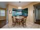 Charming breakfast nook with round table, four chairs, and large bay window at 10534 Bermuda Isle Dr, Tampa, FL 33647