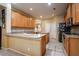 Spacious kitchen with tile floors, an island, light countertops and wood cabinetry at 10534 Bermuda Isle Dr, Tampa, FL 33647