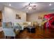 Cozy living room featuring hardwood floors, comfortable seating, and stylish artwork at 10534 Bermuda Isle Dr, Tampa, FL 33647