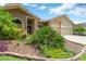 Beautifully landscaped front yard with lush plantings and brick-edged garden beds create inviting curb appeal at 11209 Bloomington Dr, Tampa, FL 33635