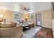 Comfortable living room with cozy seating, a ceiling fan, and easy access to an exterior door at 1157 Brook Rd, Clearwater, FL 33755
