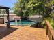 Backyard pool and deck area featuring an in-ground pool, and wood deck, perfect for outdoor enjoyment at 1157 Brook Rd, Clearwater, FL 33755