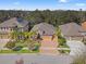 Beautiful neighborhood featuring manicured lawns, brick driveways, and mature trees at 13711 Moonstone Canyon Dr, Riverview, FL 33579