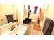 Bathroom with vanity, sink, toilet, shower and towels at 1372 Palmetto St, Clearwater, FL 33755