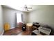 Bedroom needs clean up with wood floors and a ceiling fan at 1372 Palmetto St, Clearwater, FL 33755