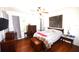 Spacious bedroom with hardwood floors, ceiling fan, and plenty of natural light at 1372 Palmetto St, Clearwater, FL 33755