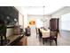 Formal dining room with tile floors, chandelier, and classic wood furniture at 1372 Palmetto St, Clearwater, FL 33755