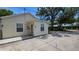 Charming home exterior featuring light yellow siding and well-maintained surroundings at 1372 Palmetto St, Clearwater, FL 33755