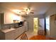 Bright kitchen features white cabinets, marble countertops, and stainless-steel appliances at 1372 Palmetto St, Clearwater, FL 33755