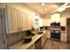 Bright kitchen featuring granite countertops, stainless steel appliances, and modern cabinetry at 1372 Palmetto St, Clearwater, FL 33755