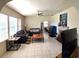 Open-concept living area with ample natural light, tile flooring, and neutral decor at 1372 Palmetto St, Clearwater, FL 33755
