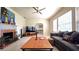Spacious living room with fireplace, comfortable seating, and tile floors at 1372 Palmetto St, Clearwater, FL 33755