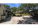 Paver patio with string lights and views of the house and screened porch at 1372 Palmetto St, Clearwater, FL 33755
